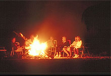 Travellers Mwaluganje Camp Fire in the Evening 